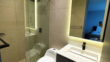 Shower, hair dryer, towels, soap