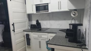 Fridge, microwave, stovetop, coffee/tea maker