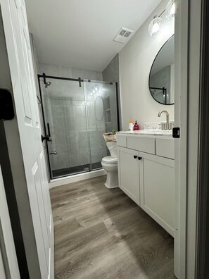 Shower, hair dryer, towels, soap