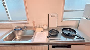 Fridge, microwave, cookware/dishes/utensils, dining tables