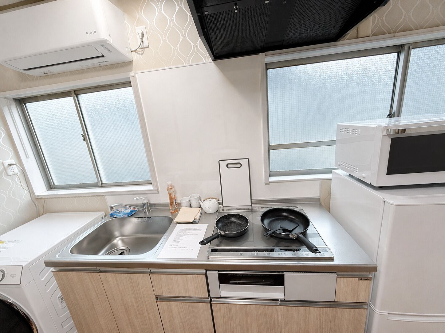 Fridge, microwave, cookware/dishes/utensils, dining table