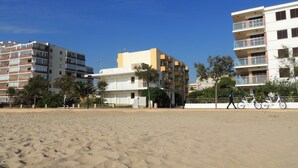 A beach with buildings in the background.