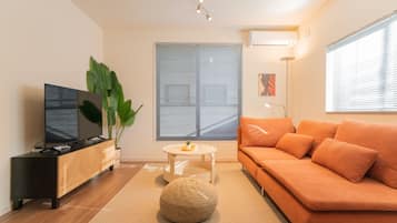 Luxury Villa | Living area | 50-inch flat-screen TV with cable channels