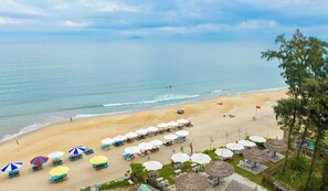 On the beach, sun loungers, beach towels
