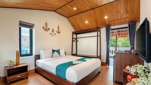 A bedroom with a wooden ceiling, a bed with a canopy, a TV, and a window with curtains. - Private Beachfront House 5BRs - An Bang Beach (Thành phố Hội An)