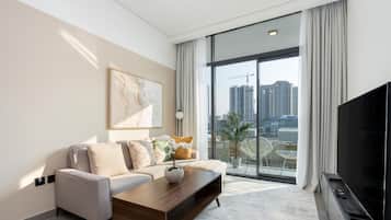 Executive Apartment, 1 Bedroom | Living area | 55-inch Smart TV with cable channels