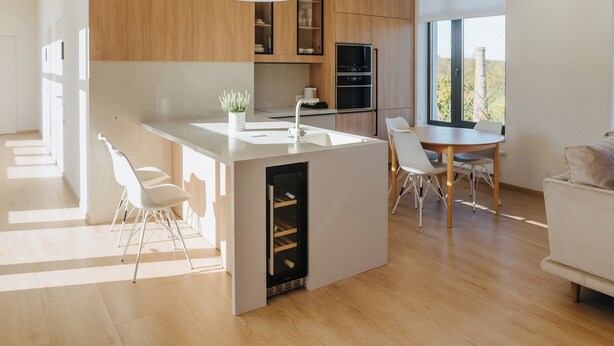 A modern kitchen with a central island, white chairs, and a dining table. - Forest Retreat Center (Kyiv)