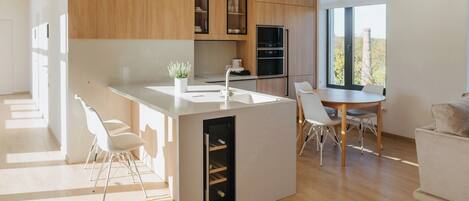 Deluxe Penthouse | Living area | 80-inch Smart TV with digital channels