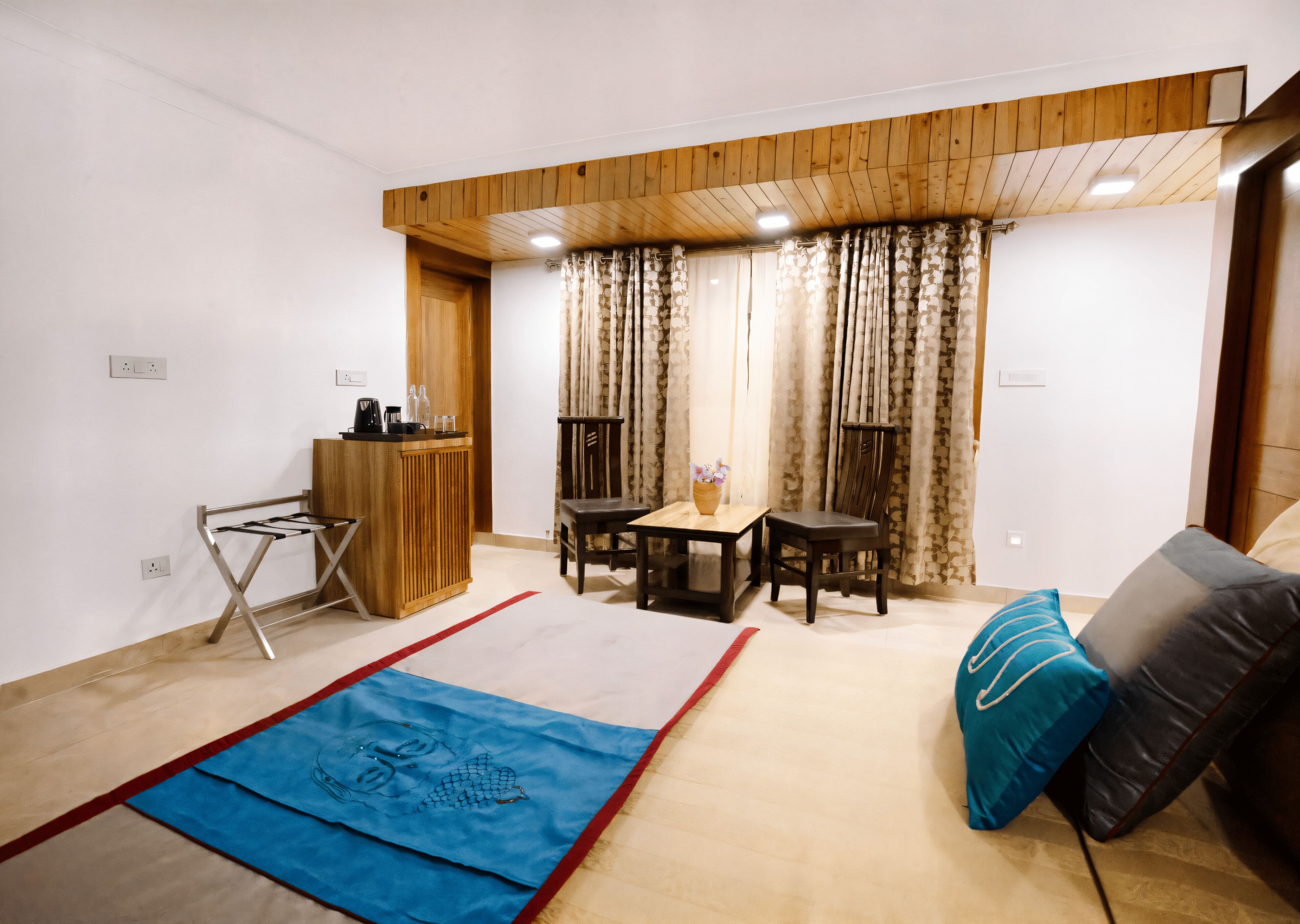A compact living space with a kitchenette, a dining area, and a sofa.