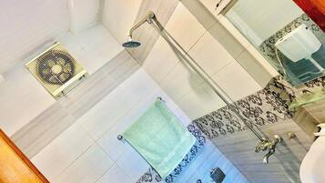 Shower, towels, soap, toilet paper