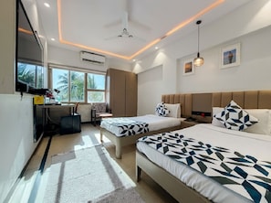 A modern hotel room with two beds, a desk, a chair, and a large window.
