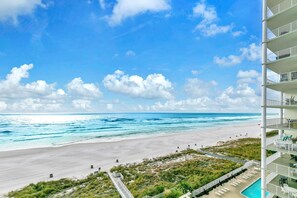 A beachfront hotel with a pool, beach access, and a view of the ocean. - Twin Palms 702 (Panama City Beach)