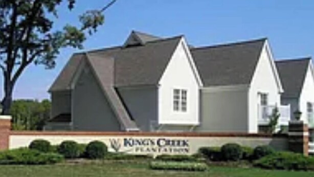 A large, white building with a steeply pitched roof, likely a hotel or residential complex, with a sign reading "King's Creek Plantation" in front. - Spacious 3-bedroom Villa apartment with AC, WiFi in charming Williamsburg (Williamsburg)