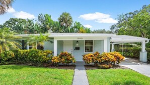 A single-story house with a white exterior, a covered porch, and a number '940' on the front. - Downtown Las Olas Paradise + HOT TUB (Fort Lauderdale)
