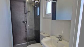 Shower, eco-friendly toiletries, hair dryer, towels