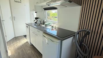 Fridge, stovetop, dishwasher, coffee/tea maker