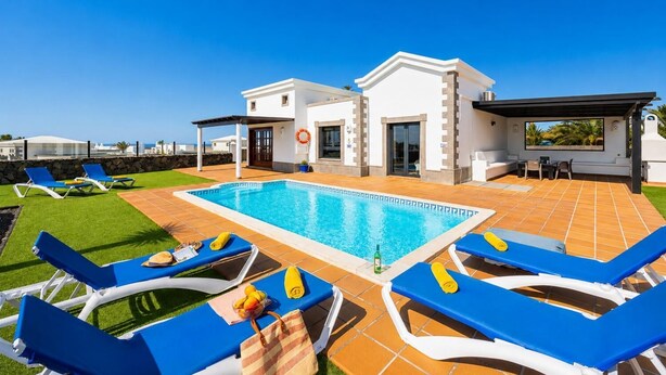 A modern villa with a swimming pool, sun loungers, and a covered outdoor area. - Villa Dragos - Three Bedroom Villa, Sleeps 6 (Montaña Roja)
