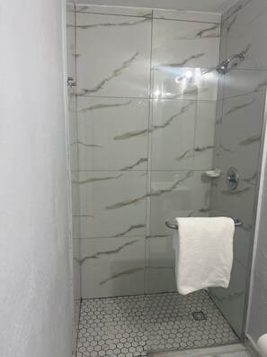 Shower, towels, soap, toilet paper