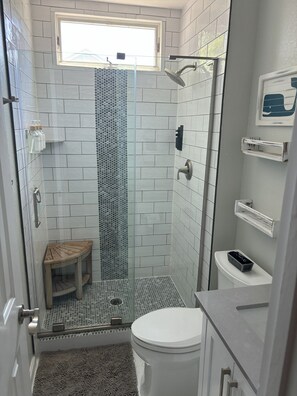 Shower, eco-friendly toiletries, hair dryer, towels