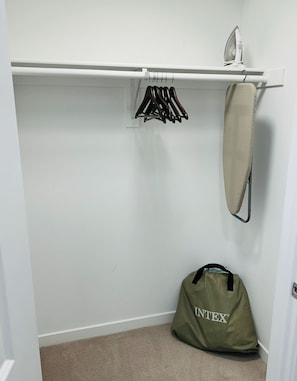 Ample storage space with a hanging rod and shelf for your belongings.