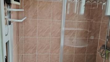 Shower, towels, soap, toilet paper