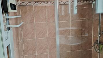 Shower, towels, soap, toilet paper