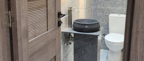 Shower, towels, soap, toilet paper