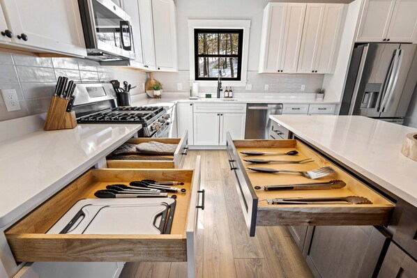 A modern kitchen with white cabinets, stainless steel appliances, and wooden countertops. - Heated POOL|Views|HotTub|Sauna|2mi to SR Golf Club (Bethel)