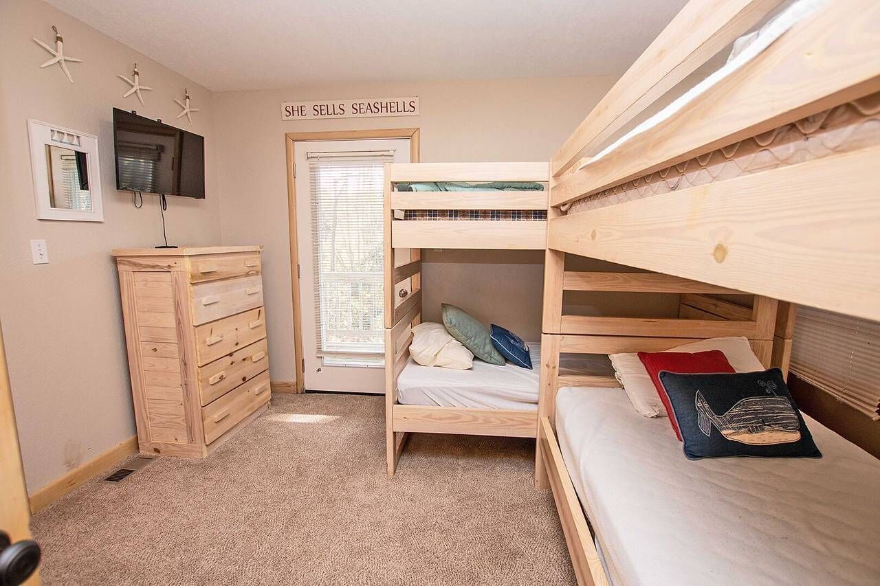 Mid Level Bunk Bedroom with Two Twin-Over-Twin Bunk Beds, TV,Deck Access and a Fun and Flexible Setup for Multiple Guests.