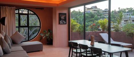 Deluxe Apartment | Living area | 50-inch Smart TV with digital channels, table tennis, books