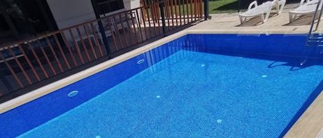 Outdoor pool, sun loungers