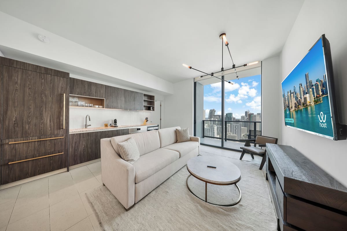 Deluxe Apartment, 2 Bedrooms, City View | Living area | 50-inch Smart TV with cable channels