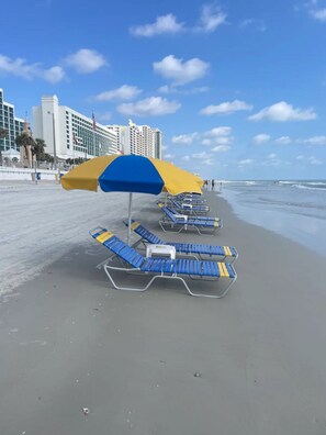 On the beach, sun-loungers, beach towels