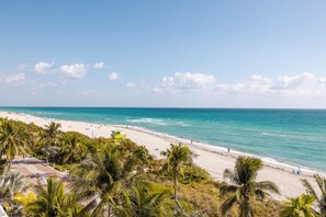 On the beach, sun-loungers, beach towels