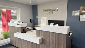 A reception desk with a sign reading "Rodeway Inn" and a check-out counter. - Rodeway Inn Las Vegas Fremont Street (Las Vegas)
