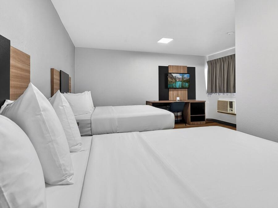 Desk, blackout curtains, bed sheets