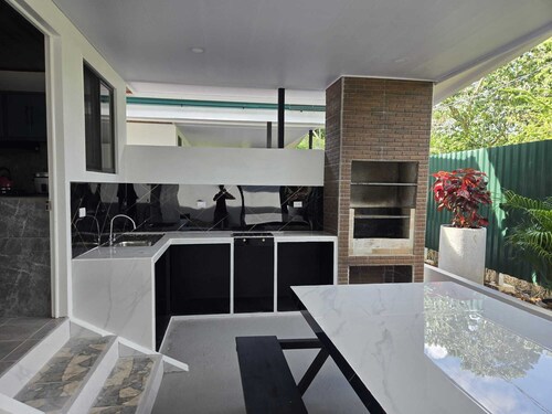 Spacious 2 bedroom beach house with AC WIFI BBQ Terrace and car port