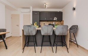 Fridge, stovetop, dishwasher, coffee/tea maker