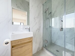 Shower, hair dryer, towels, soap