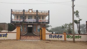 A two-story building with a signboard at the entrance. - Shree Vishvakarma Resorts (Taranagar)