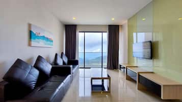 Apartment, 2 Bedrooms | Living area | 40-inch TV with cable channels