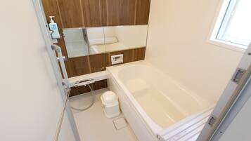 Hair dryer, bidet, towels, soap