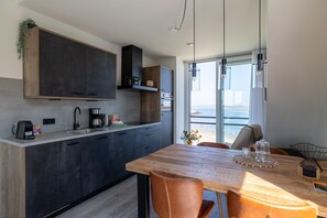 Private kitchen | Fridge, dishwasher, coffee/tea maker, electric kettle - Lush Apartment With Water Views (Sint-Annaland)