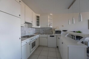 Comfort Apartment, 3 Bedrooms | Private kitchen | Microwave, oven, dishwasher, coffee/tea maker