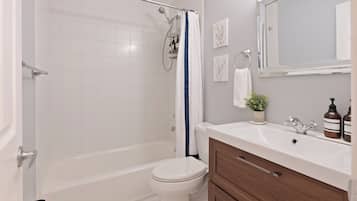 Jetted bath, hair dryer, towels, soap