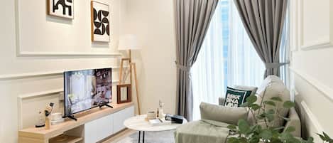 Apartment, 3 Bedrooms | Living area | Flat-screen TV
