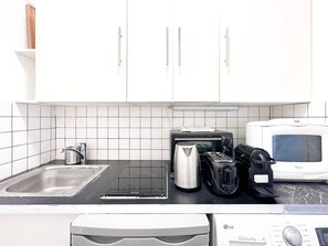 Microwave, coffee/tea maker, toaster, cookware/dishes/utensils