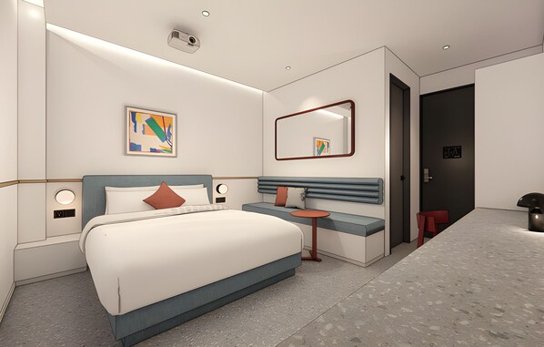 Una habitación de hotel moderna con una cama grande, mesitas de noche, una pequeña mesa redonda, un espejo y una puerta al baño.
