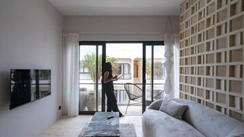 Apartment, 1 Bedroom, Balcony, Pool View | Living room | 43-inch TV with cable channels