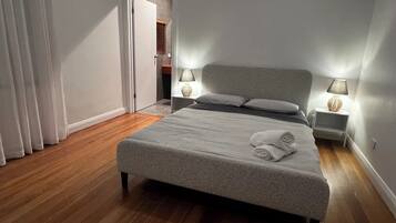 1 bedroom, desk, bed sheets